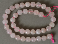 Light colored rose quartz round beads.