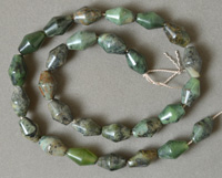 Double cone barrel beads from green zoisite.