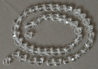  faceted round beads from clear Czech glass.