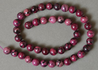 10mm round beads from purple Jade.