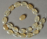 Oval beads from yellow tourmaline.