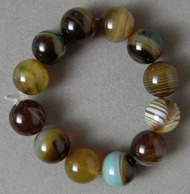 12 round beads from brown and blue agate.