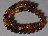 10mm round beads from red to brown dream agate.