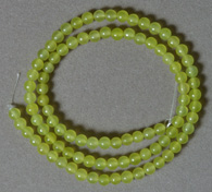 Small round beads from yellow green peridot.