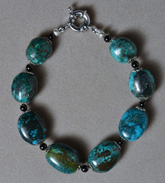 Bracelet from blue turquoise oval beads.